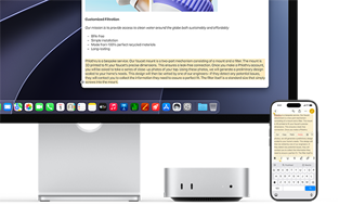 Mac mini de face, glissé sous un Studio Display, un iPhone se trouve à droite de l’appareil et de l’écran, du texte sélectionné avec les commandes Couper, Copier, Coller et Remplissage automatique en haut de l’iPhone correspond au texte surligné à l’écran, illustrant le fonctionnement du presse-papiers universel